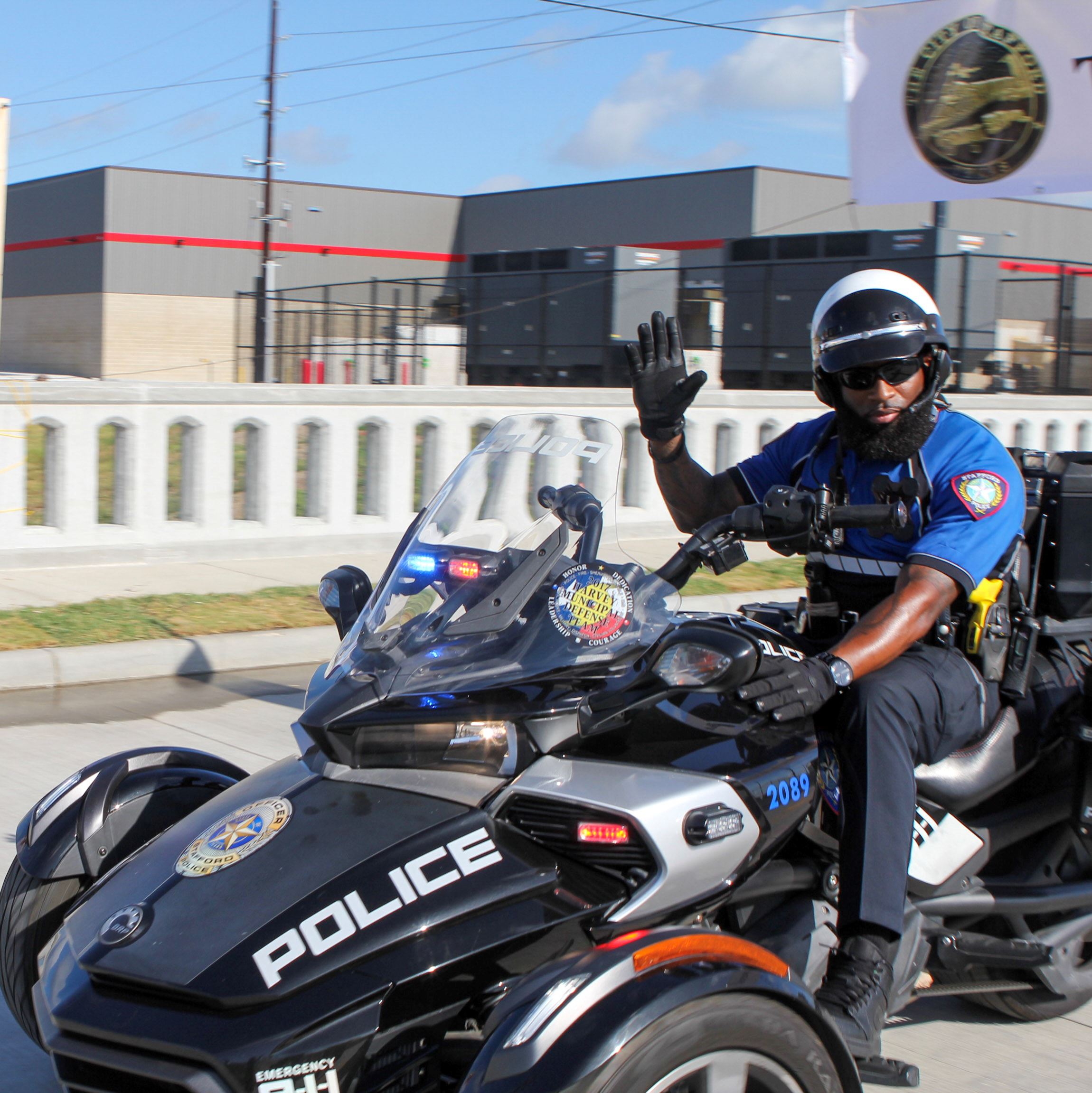 Police officer driving through Trinity Dr